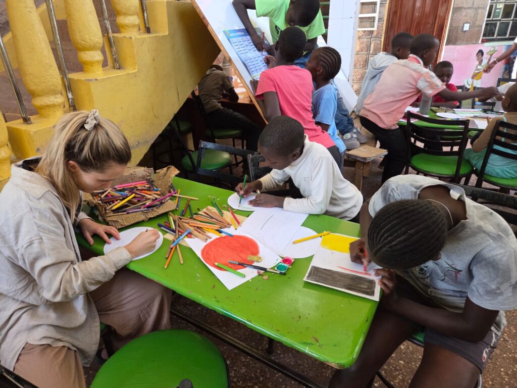 2026 – 07: Theresa and Anna painting at the green table